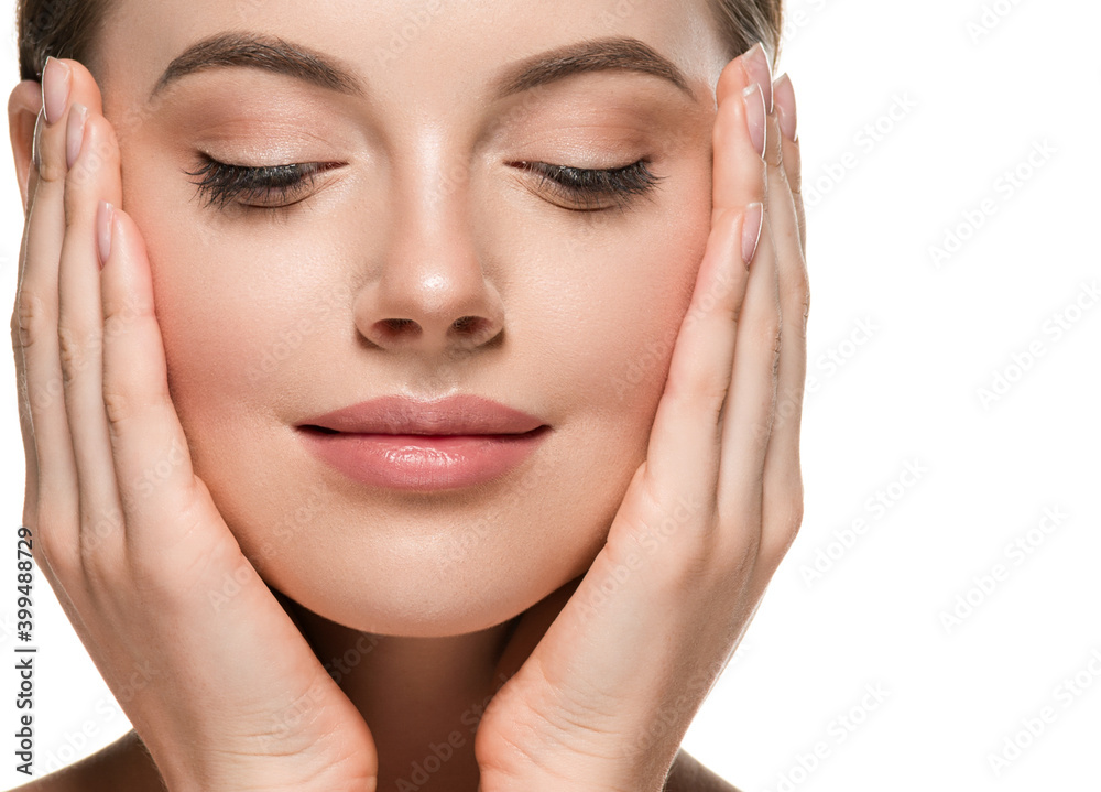 Beautiful woman face hands touching cheeks with healthy clean beauty skin close up Beautiful woman face hands touching cheeks with healthy clean beauty skin close up