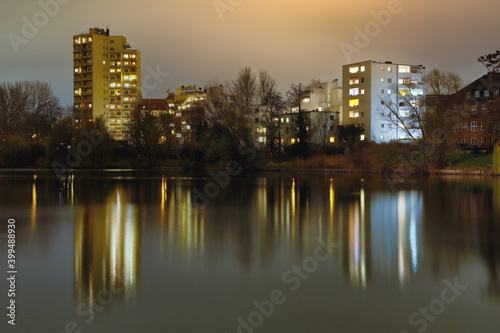 Lietzensee Park with adjacent buildings in the Berlin capital district of Charlottenburg on a winter December evening. photo