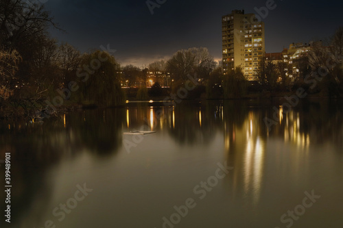 Lietzensee Park with adjacent buildings in the Berlin capital district of Charlottenburg on a winter December evening.