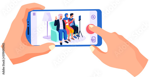 People of arab nationality give interviews on camera. Woman with phone in hands is recording a video massage from this people and smiling. Man and woman are broadcasting online with using a phone