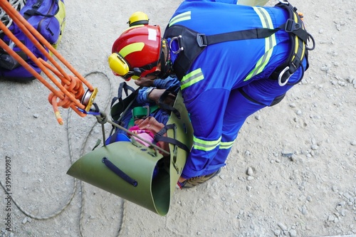 Sked stretches encapsulate injured workers to take off scaffolding in working at heights and transfer them to the field medical team as part of emergency drills at a chemical plant oil and gas factory photo