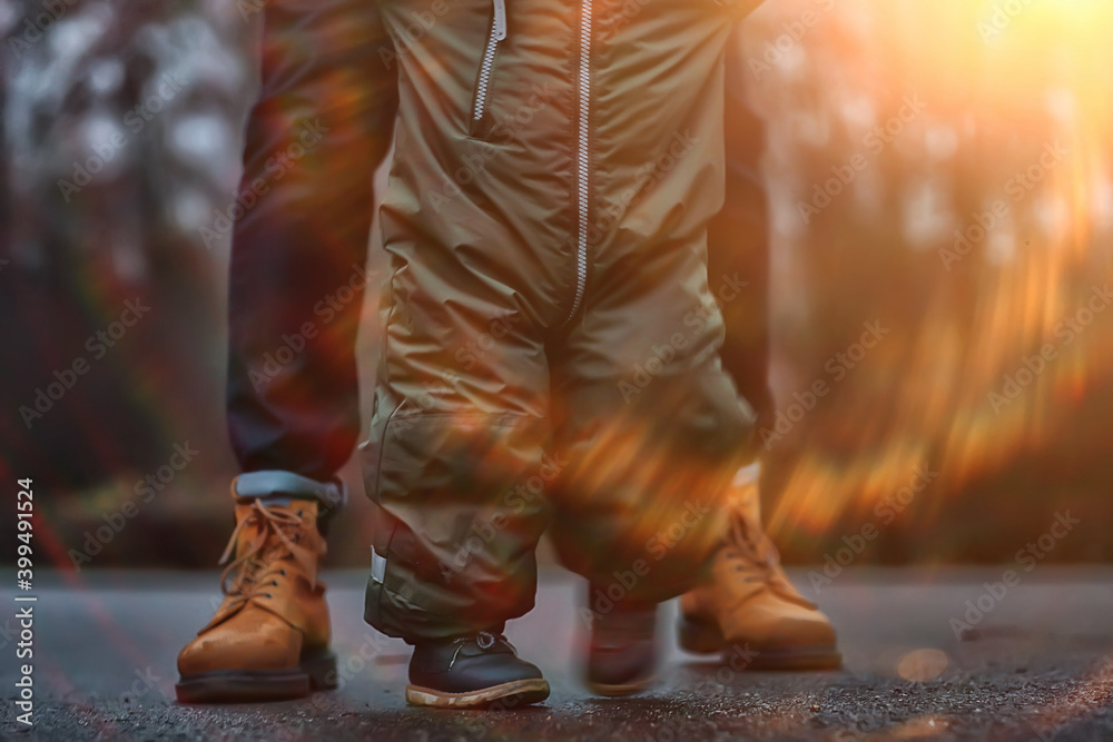 first step kid learns to walk, walk child and father in autumn in the park, winter style november first step kid learns to walk, walk child and father in autumn in the park, winter style november