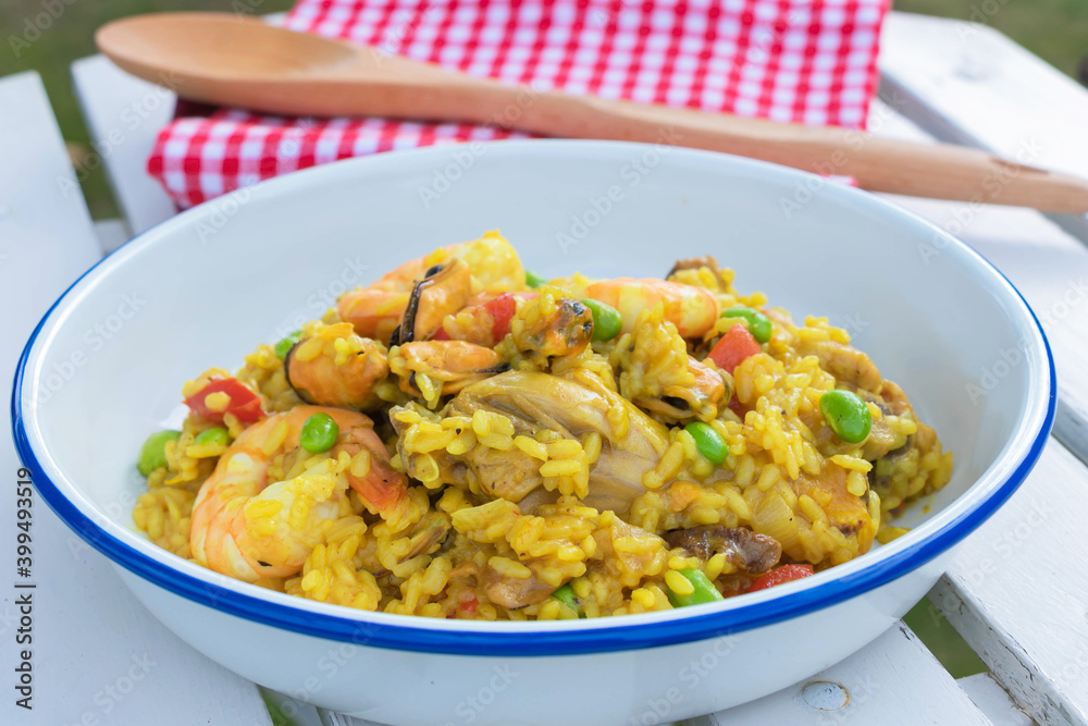Top view of Paella spanish food with seafood, mussels, shrimps, chicken and rice with saffron mediterrnean dish. Top view of Paella spanish food with seafood, mussels, shrimps, chicken and rice with saffron mediterrnean dish.