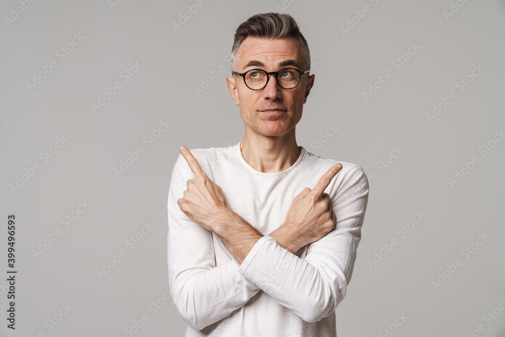 Excited handsome man presenting copy space isolated Excited handsome man presenting copy space isolated