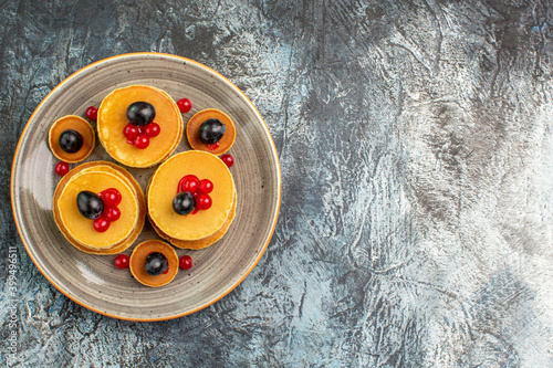 Breakfast with Classic American pancakes on a brown tray photo