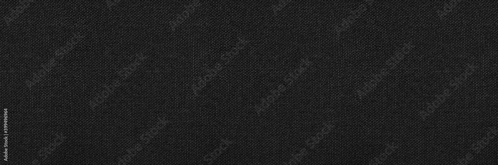Black abstract background. Black fabric texture background. Wide banner.