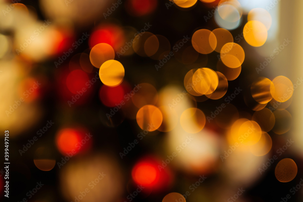 new year lights glow brightly with the rays from the garland. background texture of Christmas lights on a holiday tree. new year lights glow brightly with the rays from the garland. background texture of Christmas lights on a holiday tree.