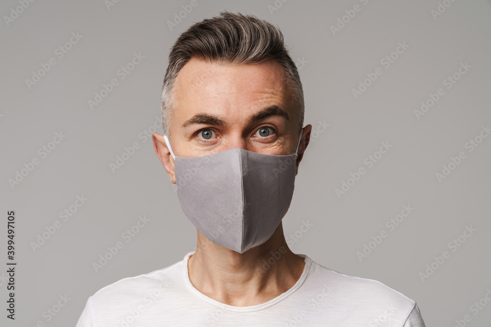 Close up of a confident man in protective medical mask Close up of a confident man in protective medical mask