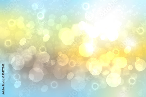 Abstract gradient of light blue yellow pastel background texture with glowing circular bokeh lights. Beautiful colorful spring or summer backdrop.