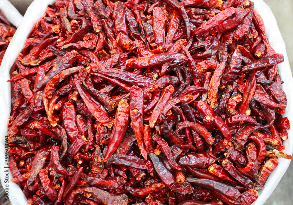 Fresh dried red chilies in a traditional market. Fresh dried red chilies in a traditional market.
