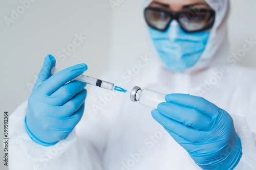 Close-up doctor hands in gloves holding syringe and vaccine. Prevention, immunization and treatment from corona virus, flue, infection. concept of vaccination, injection, medicine.