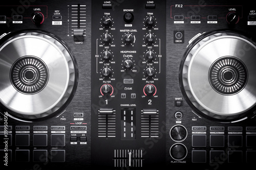 Fotografie DJ controller close up view in live performance night club dance music