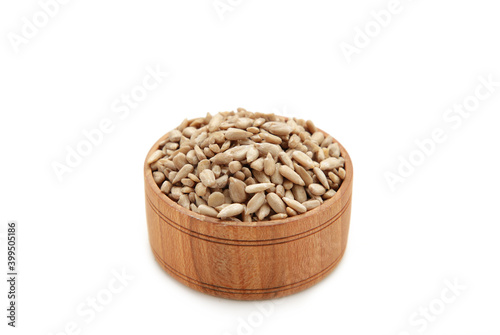 Bowl of sunflower seeds isolated on white background