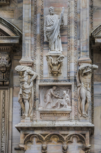 Architectural fragment of Milan Cathedral (Duomo di Milano, 1386), dedicated to St Mary of the Nativity (Santa Maria Nascente), with Gothic and Lombard Romanesque style. Milan, Italy.