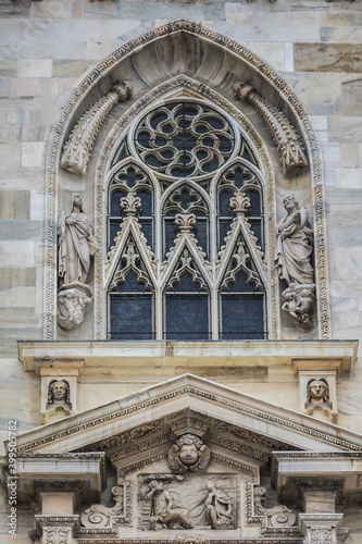 Architectural fragment of Milan Cathedral  Duomo di Milano  1386   dedicated to St Mary of the Nativity  Santa Maria Nascente   with Gothic and Lombard Romanesque style. Milan  Italy.