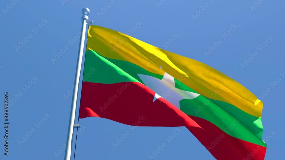 The national flag of Myanmar flutters in the wind
