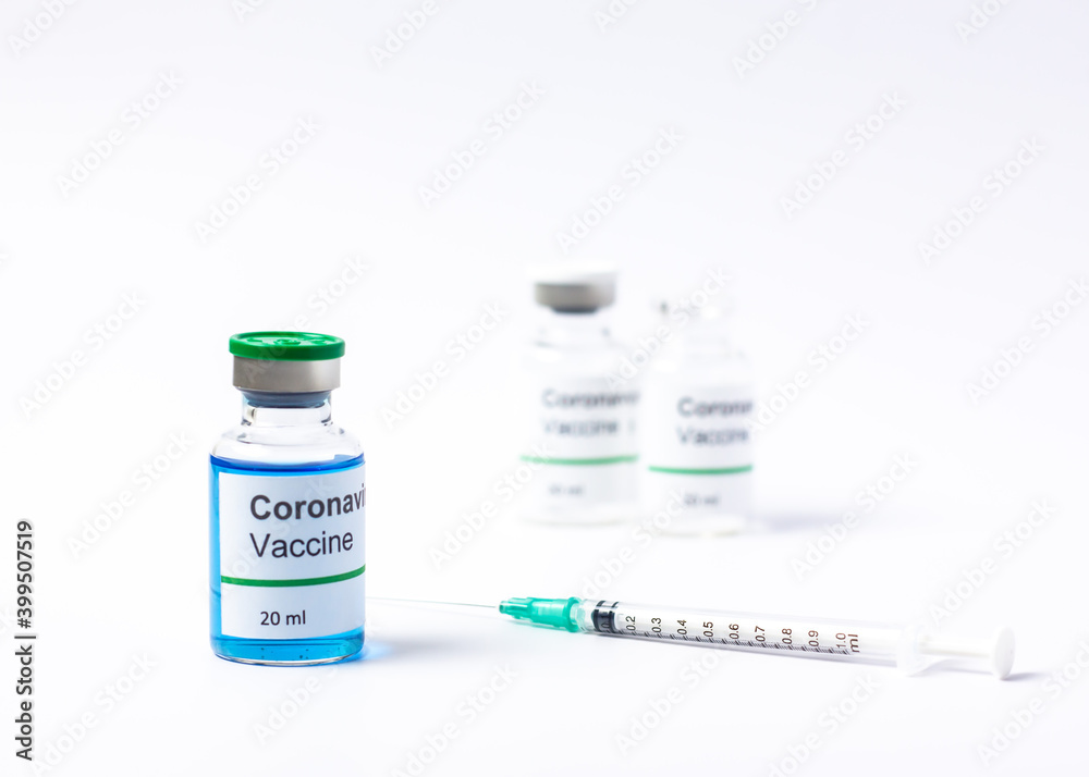 Covid -19 vaccine vial and injection syringe isolated on white background.