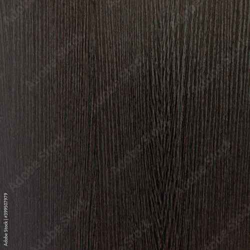 Dark brown wood background texture close-up, background and furniture surface from cabinet, table and door