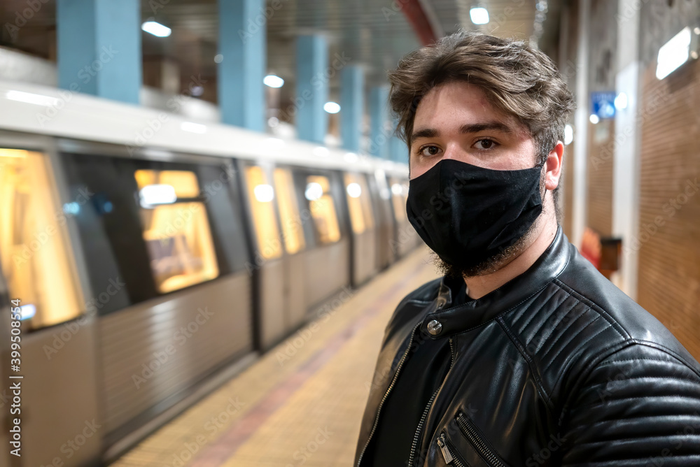 Man in medical mask in subway, Bucharest, Romania
