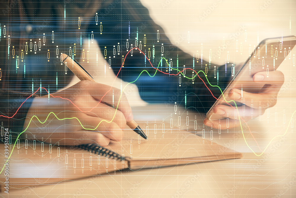 Double exposure of forex graph sketch hologram and woman holding and using a mobile device. Stock market concept.