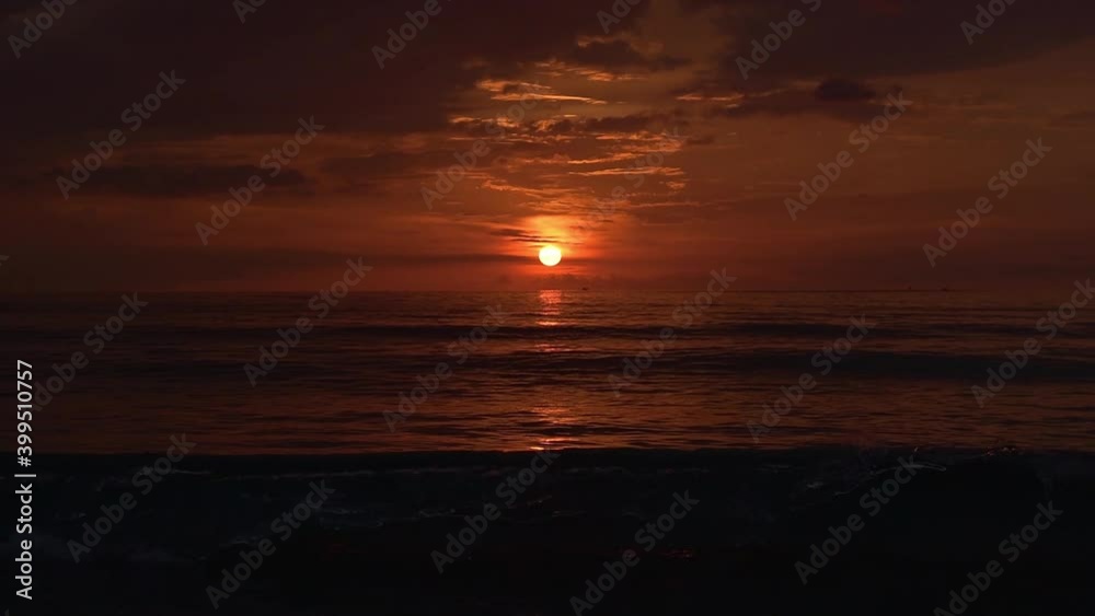 Orange cloudy sky at sundown. Beautiful ocean at orange dusk. Orange sunset at sea. Incredible sunset with orange clouds in the sky. Orange cloudy sky at sundown. Beautiful ocean at orange dusk. Orange sunset at sea. Incredible sunset with orange clouds in the sky.