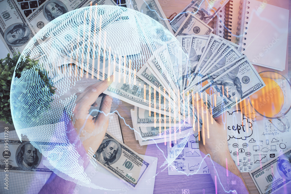 Multi exposure of financial graph drawing hologram and USA dollars bills and man hands. Analysis concept. Multi exposure of financial graph drawing hologram and USA dollars bills and man hands. Analysis concept.
