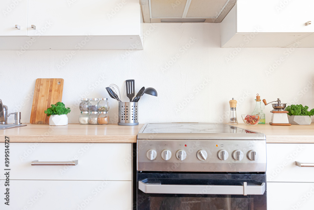 Scandinavian classic minimalistic kitchen with white and wooden details. Modern white kitchen clean contemporary style interior design. Scandinavian classic minimalistic kitchen with white and wooden details. Modern white kitchen clean contemporary style interior design.