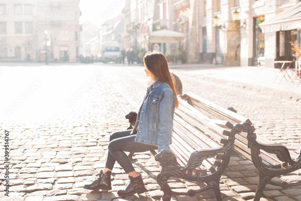 portrait of young dark haired woman exploring old beautiful city. Travel concept portrait of young dark haired woman exploring old beautiful city. Travel concept