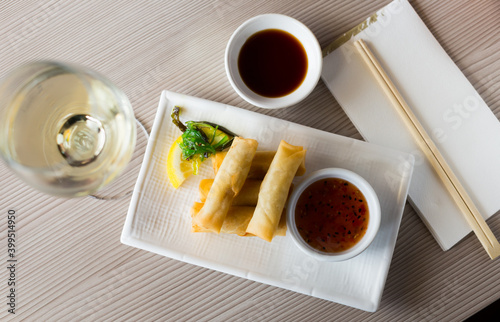 Served japanise style meal harumaki with soya and side souse photo