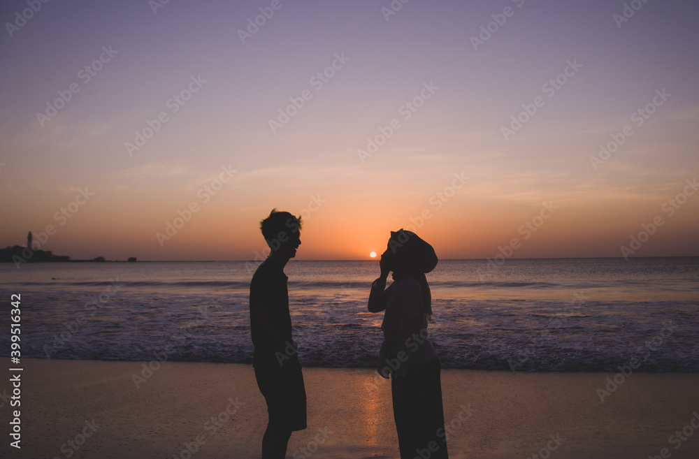 Silhouette of a couple at sunset on the beach