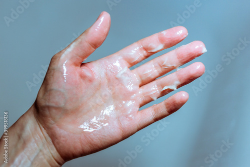 Hand covered with hand cream