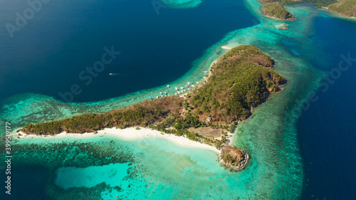 aerial view tropical island with sand white beach, palm trees. Malcapuya, Philippines, Palawan. Tropical landscape with blue lagoon, coral reef photo