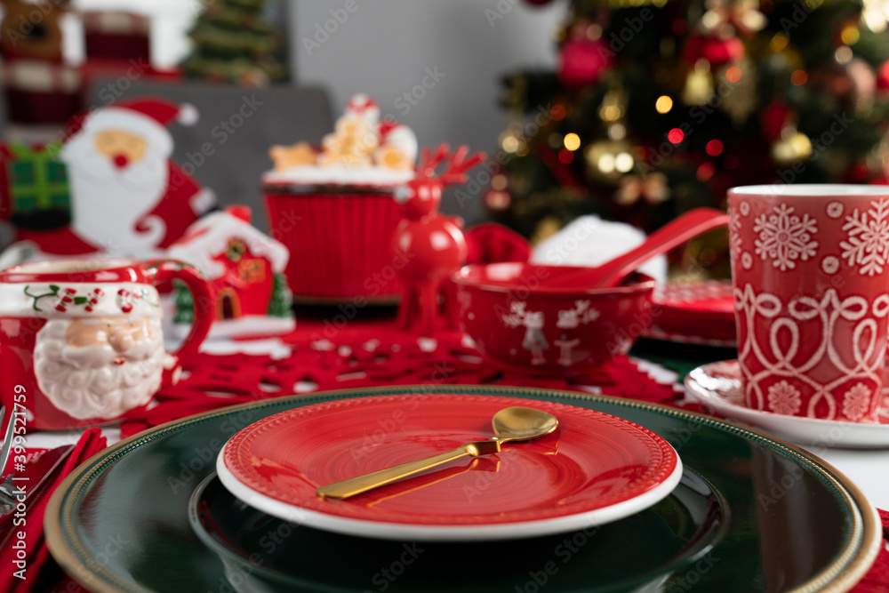 Christmas Eve. Christmas tableware and decorations on rustic wooden table.