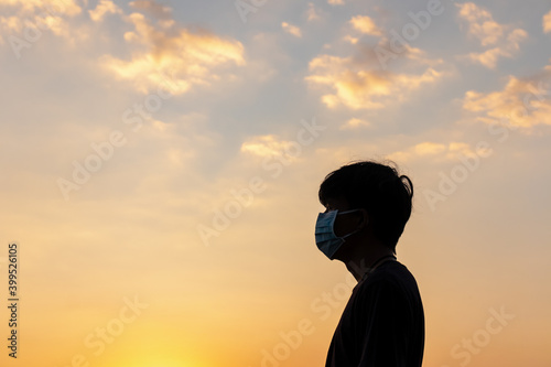 Men wearing dust masks pm 2.5 Golden sunset Independent concept and success Relax.