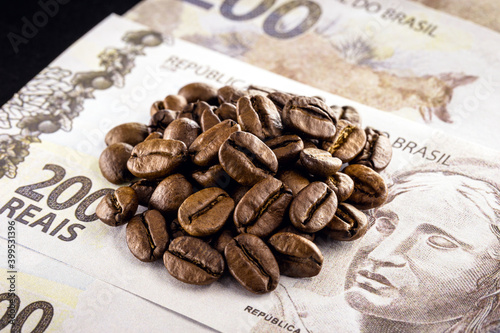lot of coffee beans  on two hundred reais bank note. Concept of Brazilian coffee export or import
