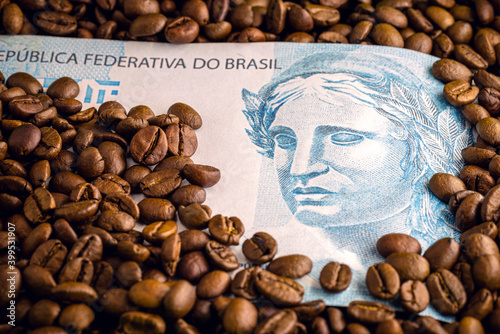 coffee from brazil  with brazilian money in the background. Concept of high quality coffee for export.