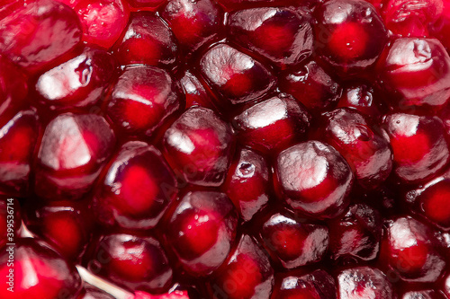 fresh pomegranate seeds macro close-up in drops