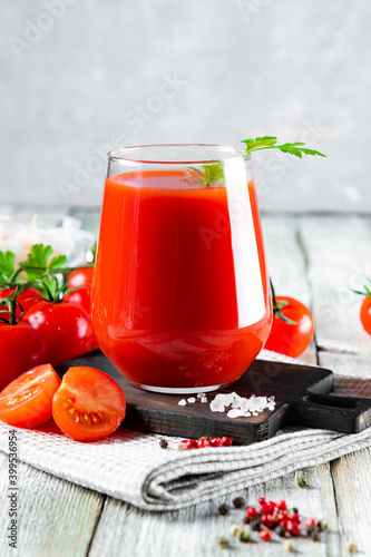  Glass of fresh tomato juice close up on the table