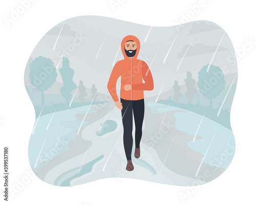 Men running in the park in the rain and snow. Sports training on the street. Runner in motion. Marathon and long runs outside. running and fitness every day in all weathers. comfortable sportswear.
