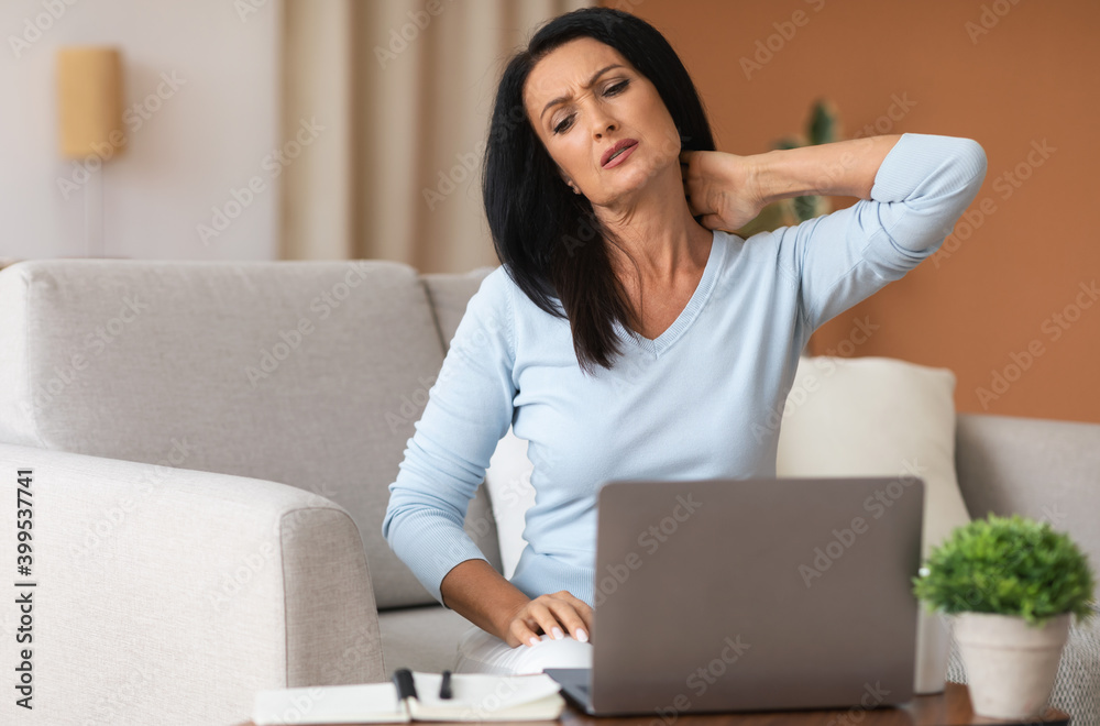 Portrait of woman with neck pain after work Portrait of woman with neck pain after work