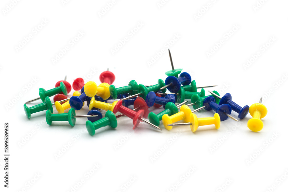 Closeup of colorful paper pins on white background Closeup of colorful paper pins on white background