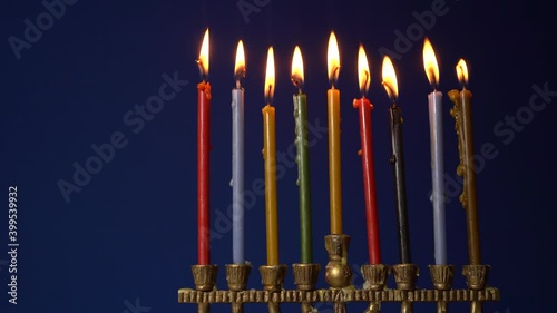 Hanukkah Menorah candelabra. Colorful candles. Jewish religious holiday in Israel. Copy spice background photo