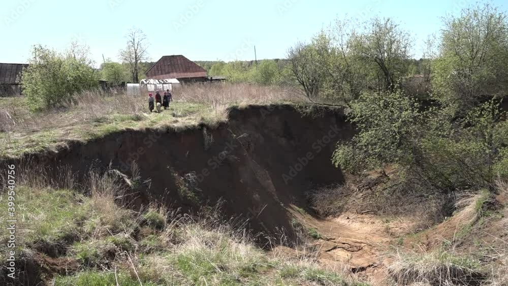 A karst sinkhole formed on the territory of village gardens. A karst sinkhole formed on the territory of village gardens.
