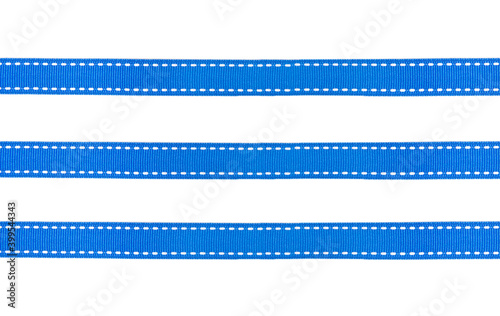  Blue fabric ribbons with white dotted lines isolated on white background