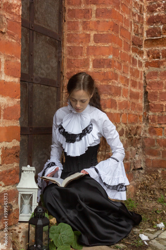 Russia, Moscow - 22/11/2020: Photo session in the style of a girl student of the 19th century. Beautiful tender girl.