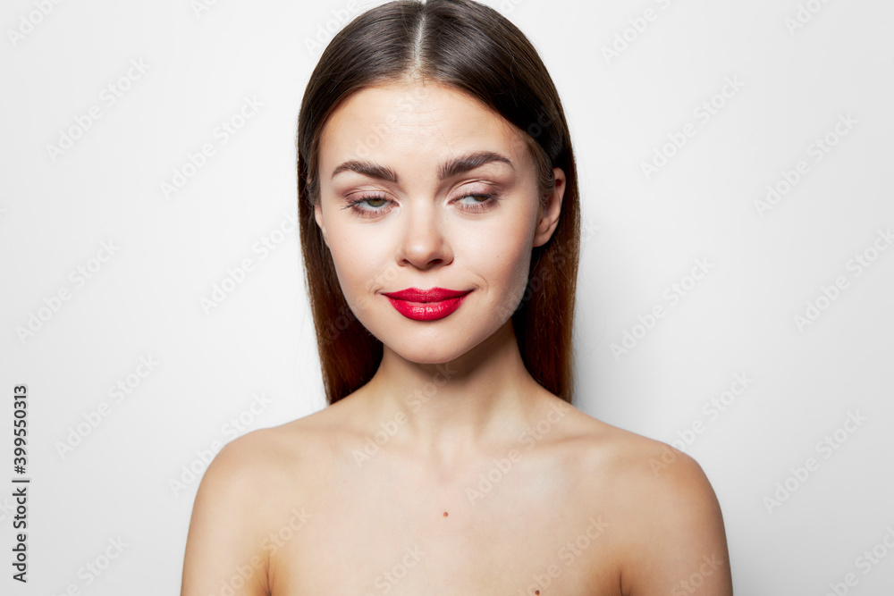 Model red lips Bare shoulders clear skin close-up Model red lips Bare shoulders clear skin close-up
