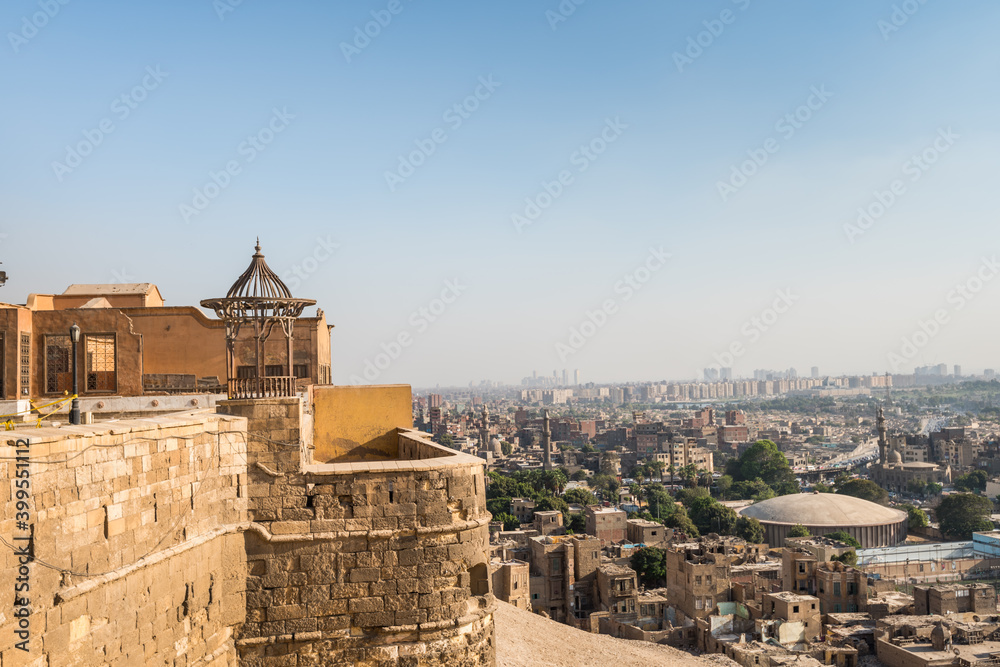 Pavilion of Saladin Citadel of Cairo and Aerial view of Cairo of crowded buildings with dusty sky