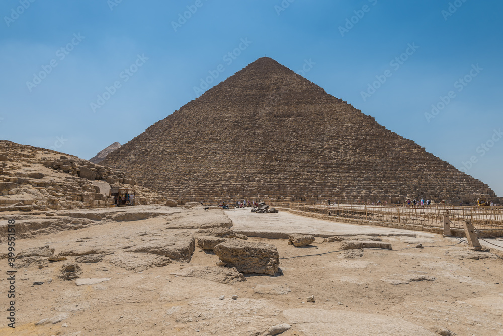 Lots of tourists visiting the Pyramid of Khufu in The Giza pyramid complex, an archaeological site on the Giza Plateau, on the outskirts of Cairo, Egypt Lots of tourists visiting the Pyramid of Khufu in The Giza pyramid complex, an archaeological site on the Giza Plateau, on the outskirts of Cairo, Egypt
