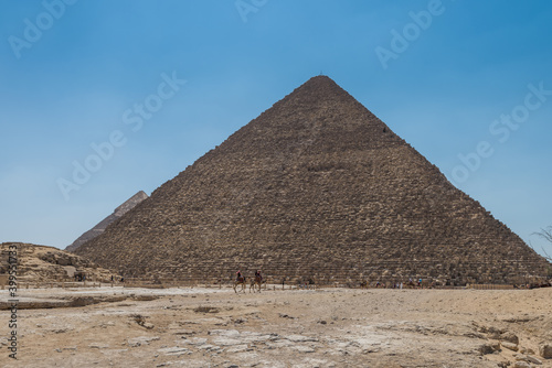 The Giza pyramid complex  an archaeological site on the Giza Plateau  on the outskirts of Cairo  Egypt. It includes the three Great Pyramids   Khufu Cheops  Khafre Chephren and Menkaure.
