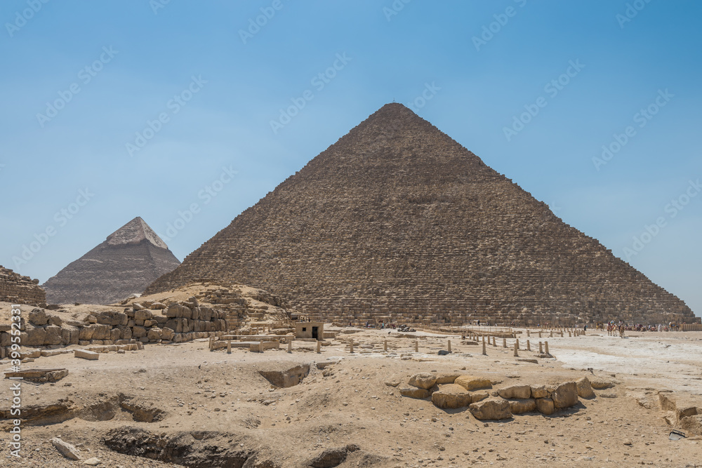 The Giza pyramid complex, an archaeological site on the Giza Plateau, on the outskirts of Cairo, Egypt. It includes the three Great Pyramids : Khufu Cheops, Khafre Chephren and Menkaure. The Giza pyramid complex, an archaeological site on the Giza Plateau, on the outskirts of Cairo, Egypt. It includes the three Great Pyramids : Khufu Cheops, Khafre Chephren and Menkaure.